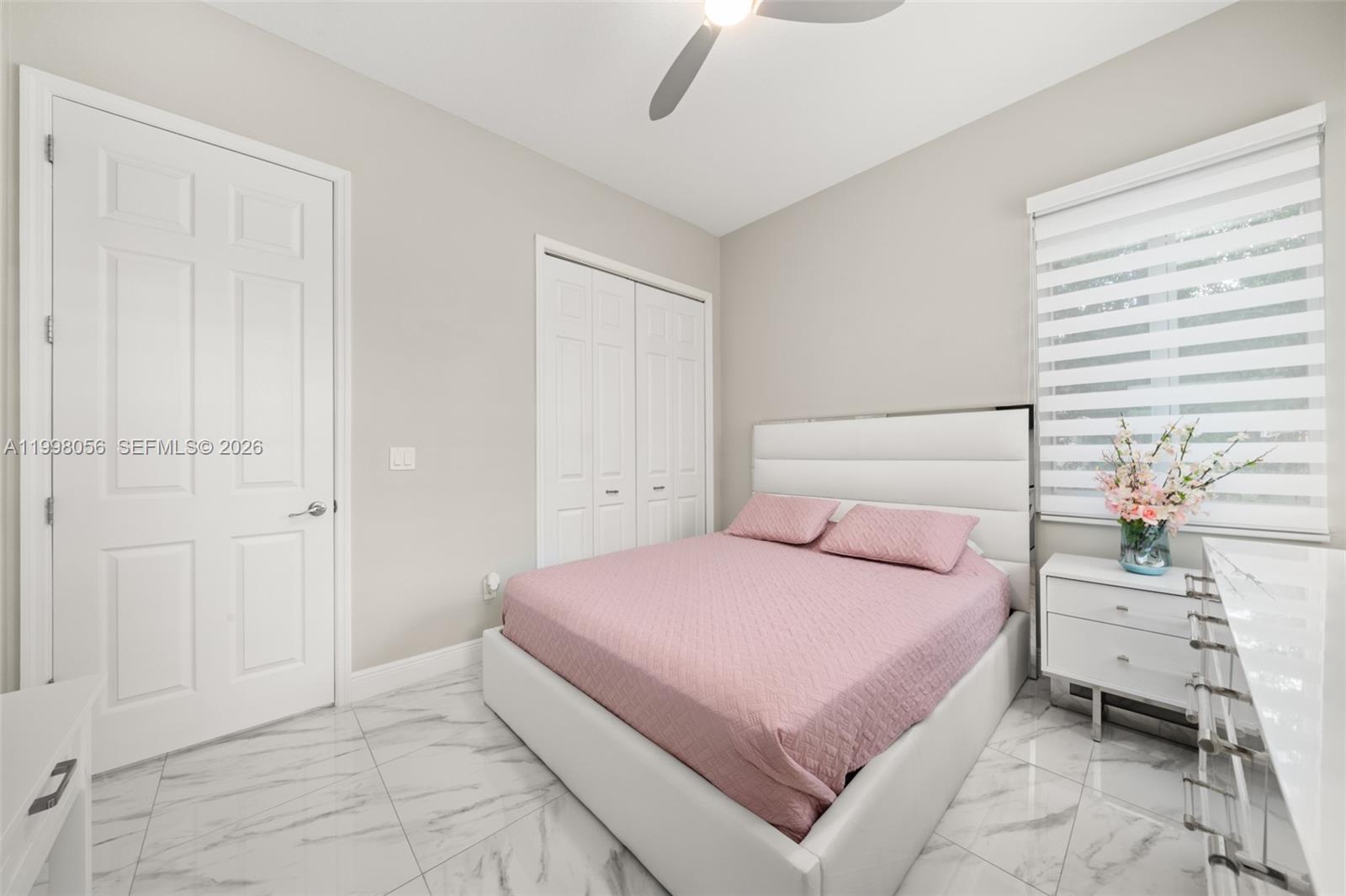 2009 Flower Sebring, FL 33875 - Photo 40 of 61 a bedroom with a bed and a window