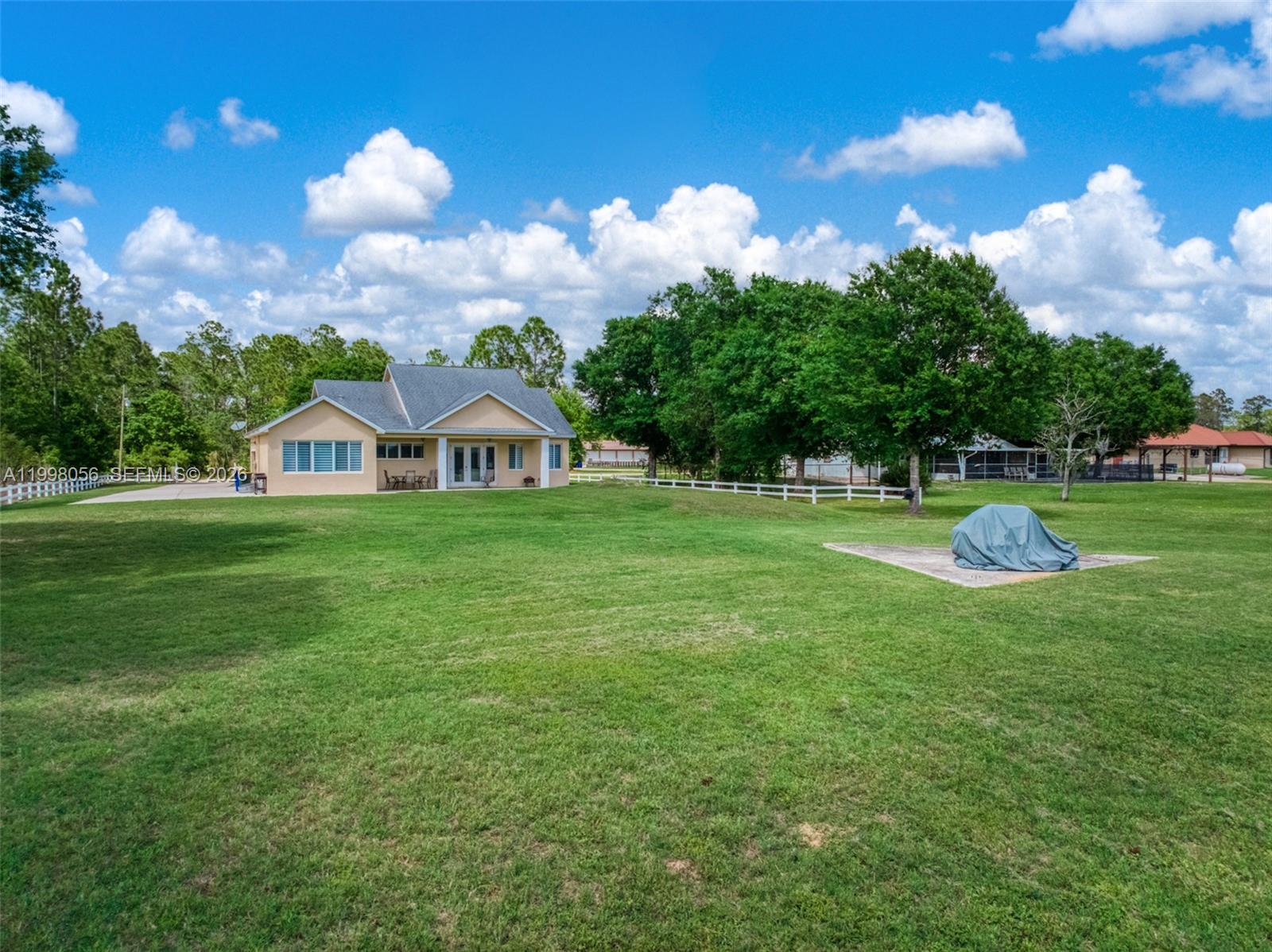 2009 Flower Sebring, FL 33875 - Photo 48 of 61 a view of a house with a big yard and garden