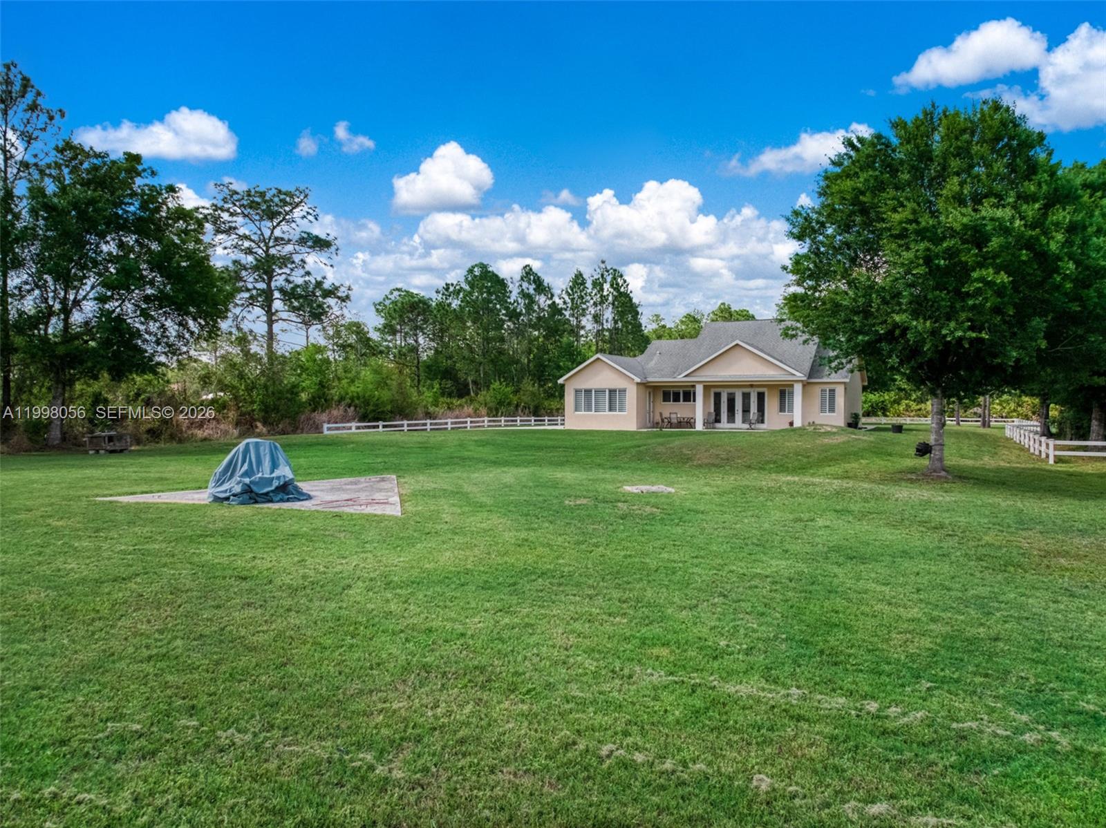 2009 Flower Sebring, FL 33875 - Photo 49 of 61 a view of a house with a yard and garden