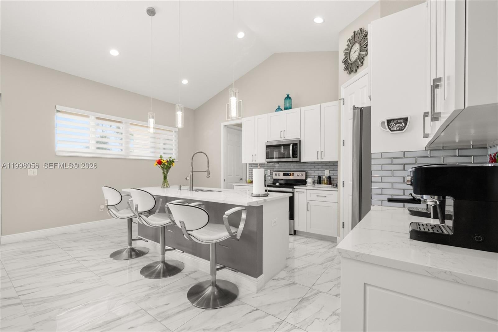 2009 Flower Sebring, FL 33875 - Photo 6 of 61 a kitchen with a sink cabinets and wooden floor