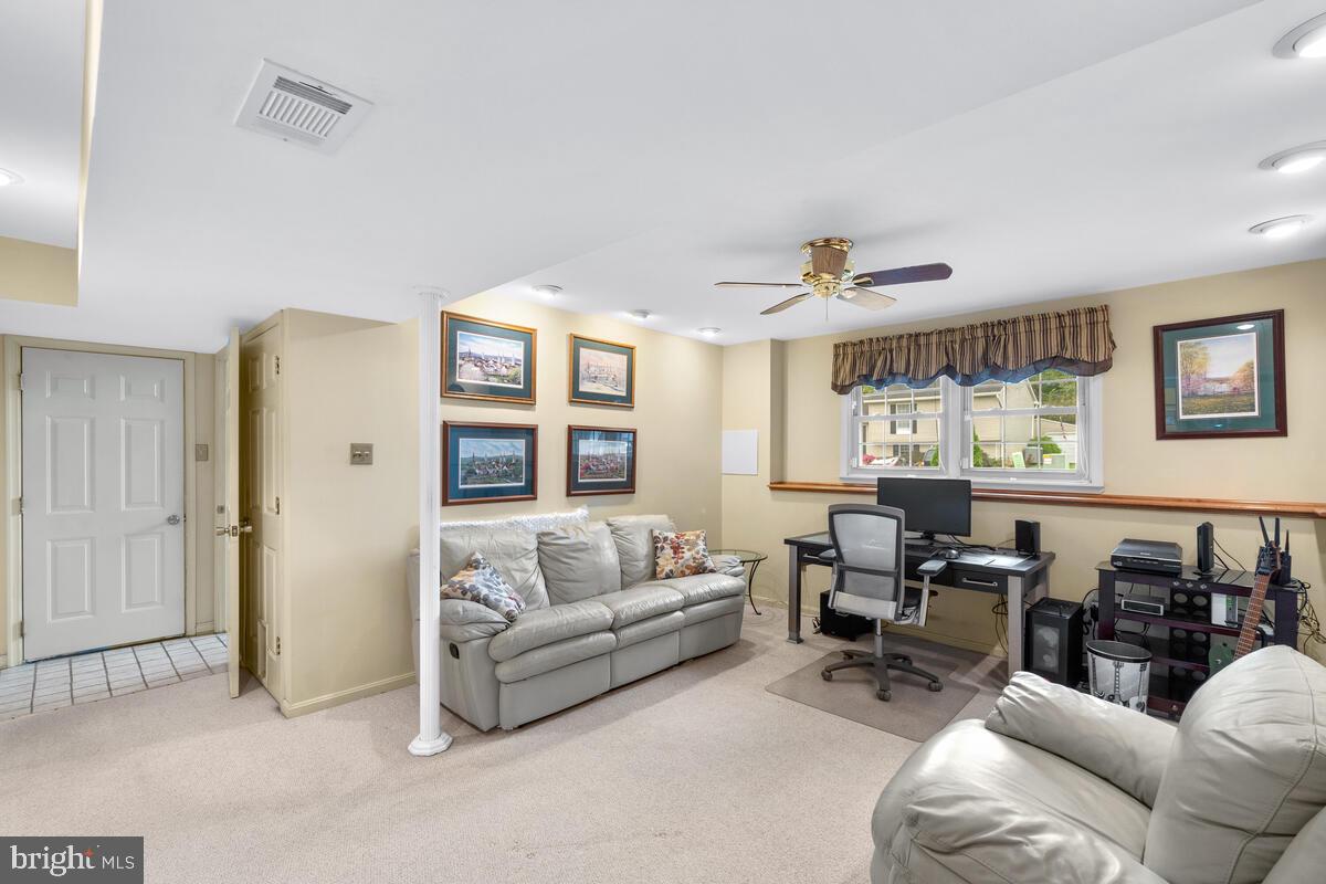 312 Cheyenne Drive Frederick, MD 21701 - Photo 28 of 43 Lower Level rec room with shelves
