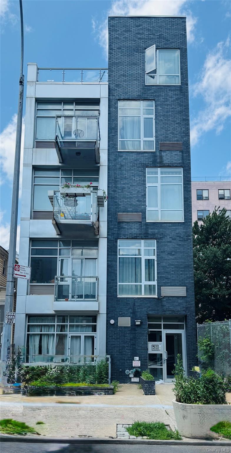 179 Monroe Street, Unit 1A Brooklyn, NY 11216 - Photo 1 of 8 a front view of residential houses with yard