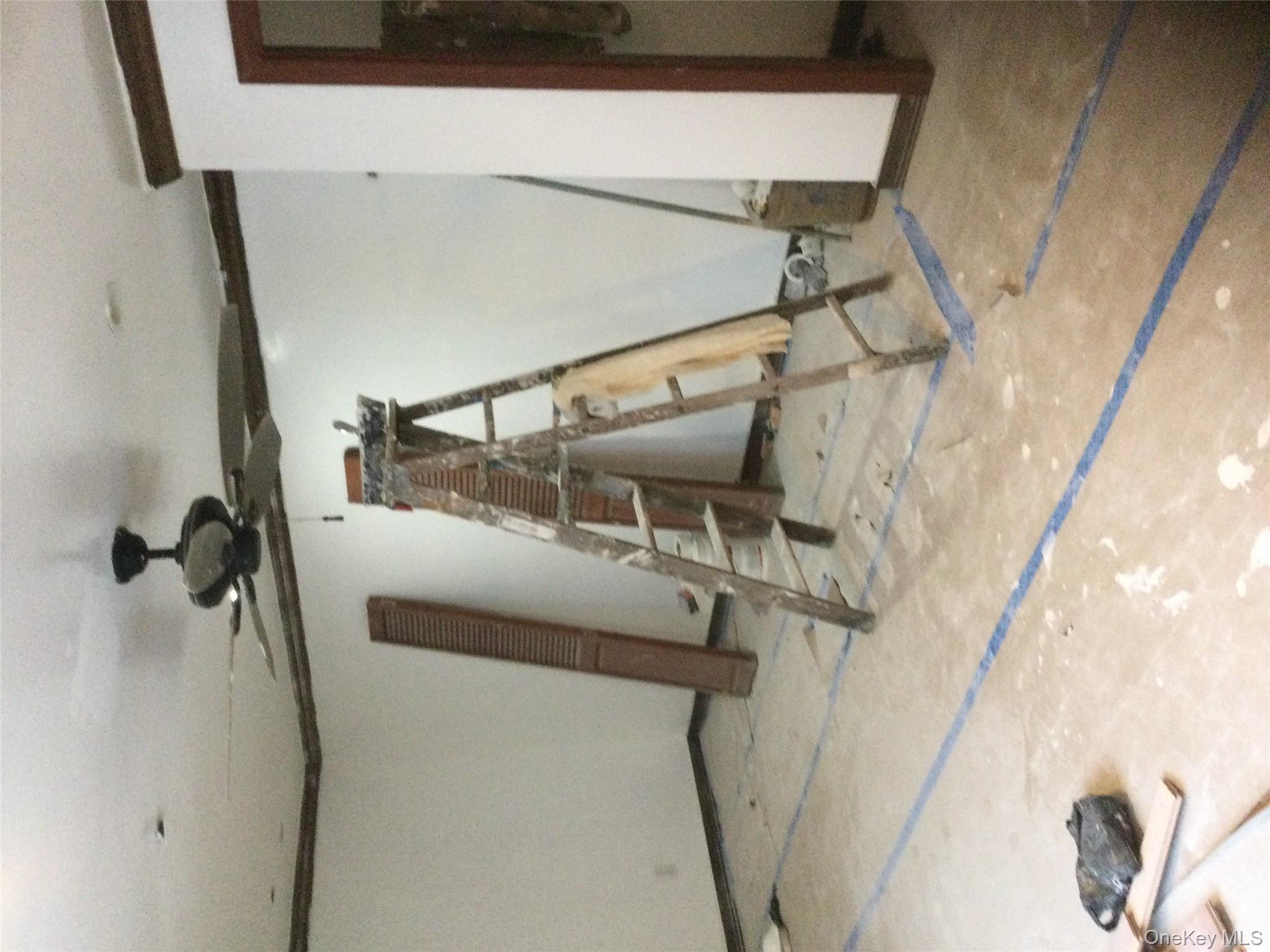 179 Monroe Street, Unit 1A Brooklyn, NY 11216 - Photo 5 of 8 a view of a room with gym equipment