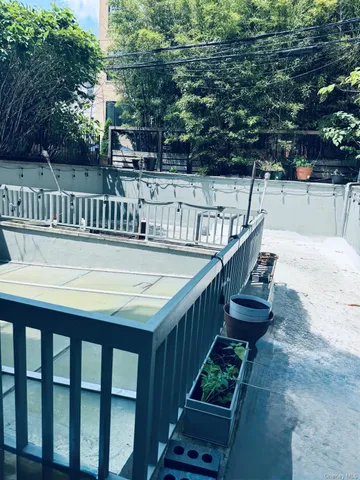 a balcony with table and chairs