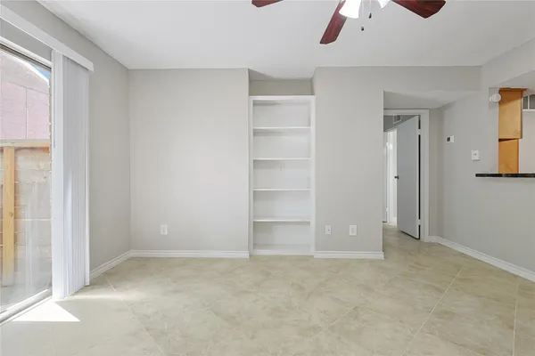 an empty room with closet area