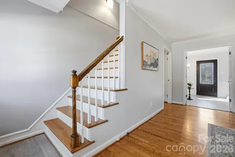 a view of entryway with wooden floor