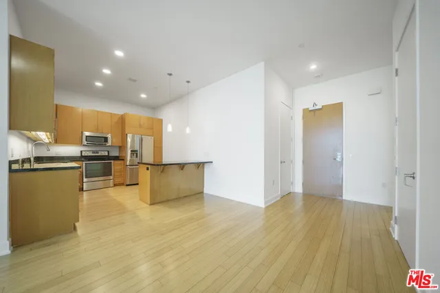 a view of kitchen dining room and wooden floor