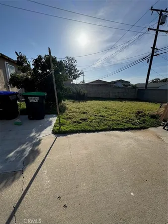 a view of a street with a garden