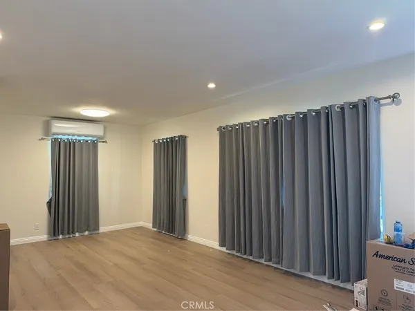 a view of a room with wooden walls