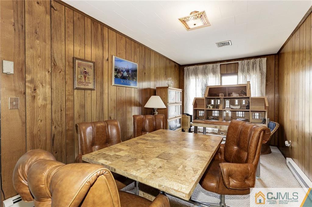 653 Lloyd Road Aberdeen, NJ 07747 - Photo 11 of 18 a dining room with furniture and window