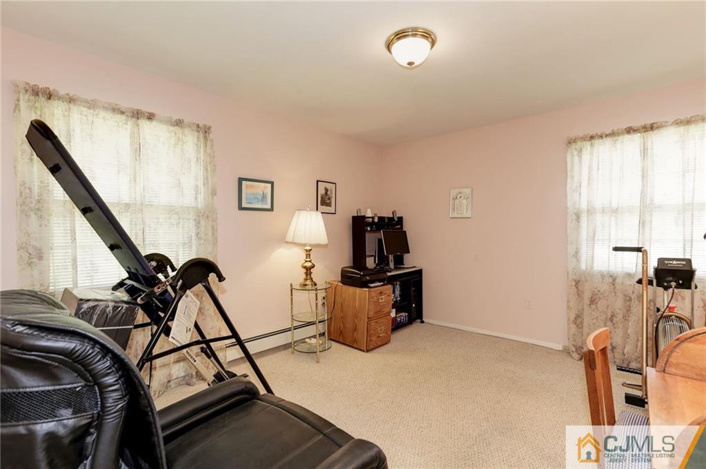 653 Lloyd Road Aberdeen, NJ 07747 - Photo 15 of 18 a view of a room with gym equipment