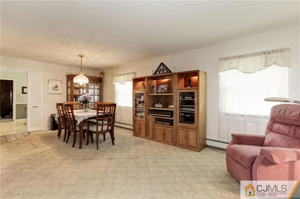 653 Lloyd Road Aberdeen, NJ 07747 - Photo 4 of 18 a view of a livingroom with furniture and window