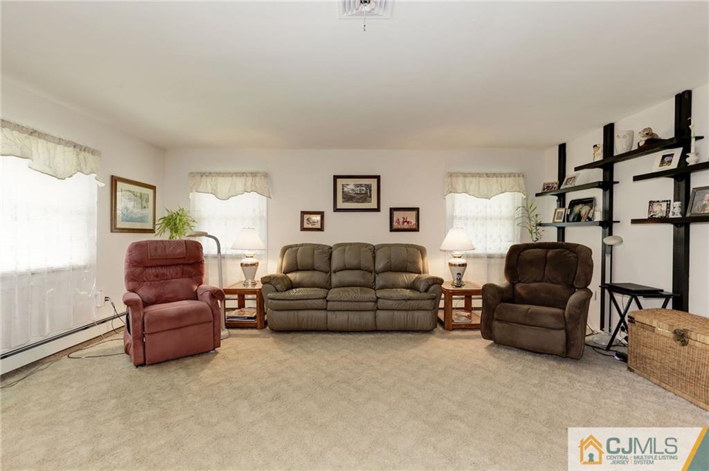 653 Lloyd Road Aberdeen, NJ 07747 - Photo 5 of 18 a living room with furniture and a couch
