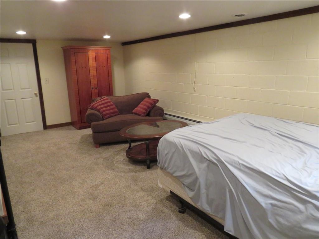 414 Dark Hollow Road Confluence, PA 15424 - Photo 18 of 25 a bed room with a bed and a couch