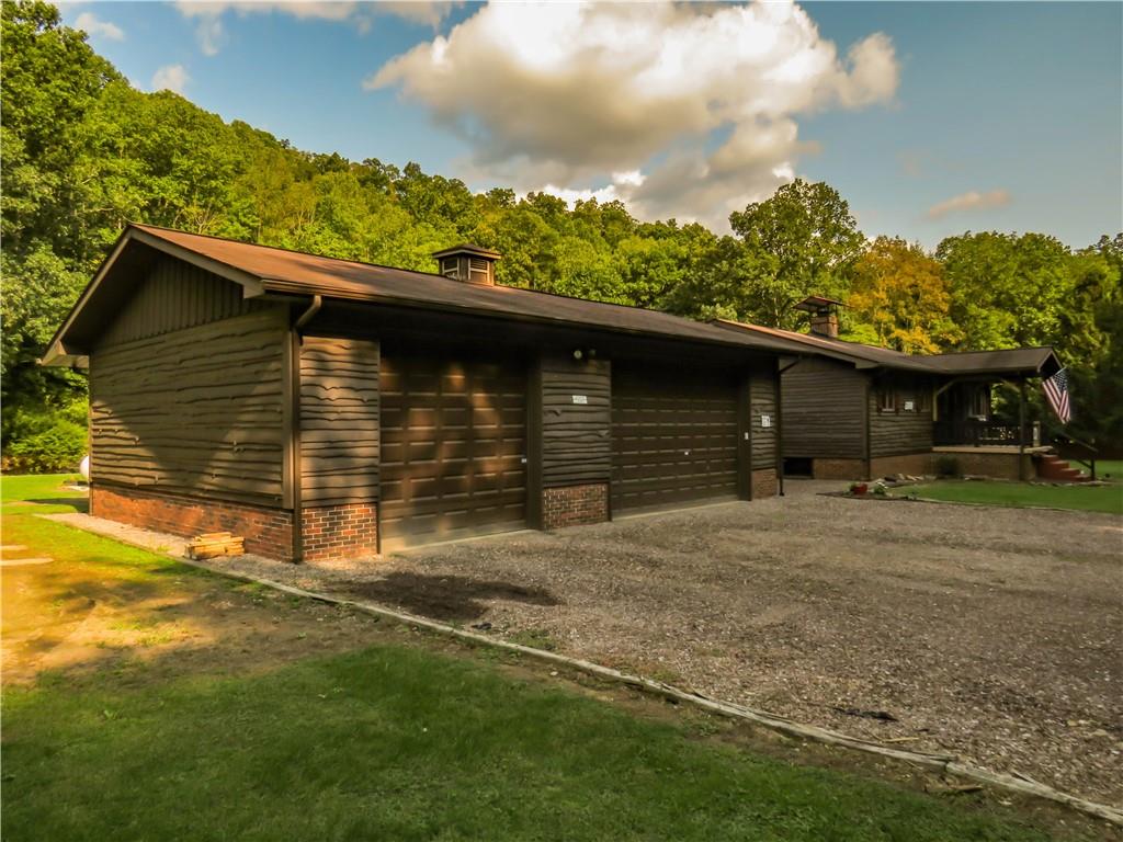 414 Dark Hollow Road Confluence, PA 15424 - Photo 22 of 25 a front view of a house with a yard