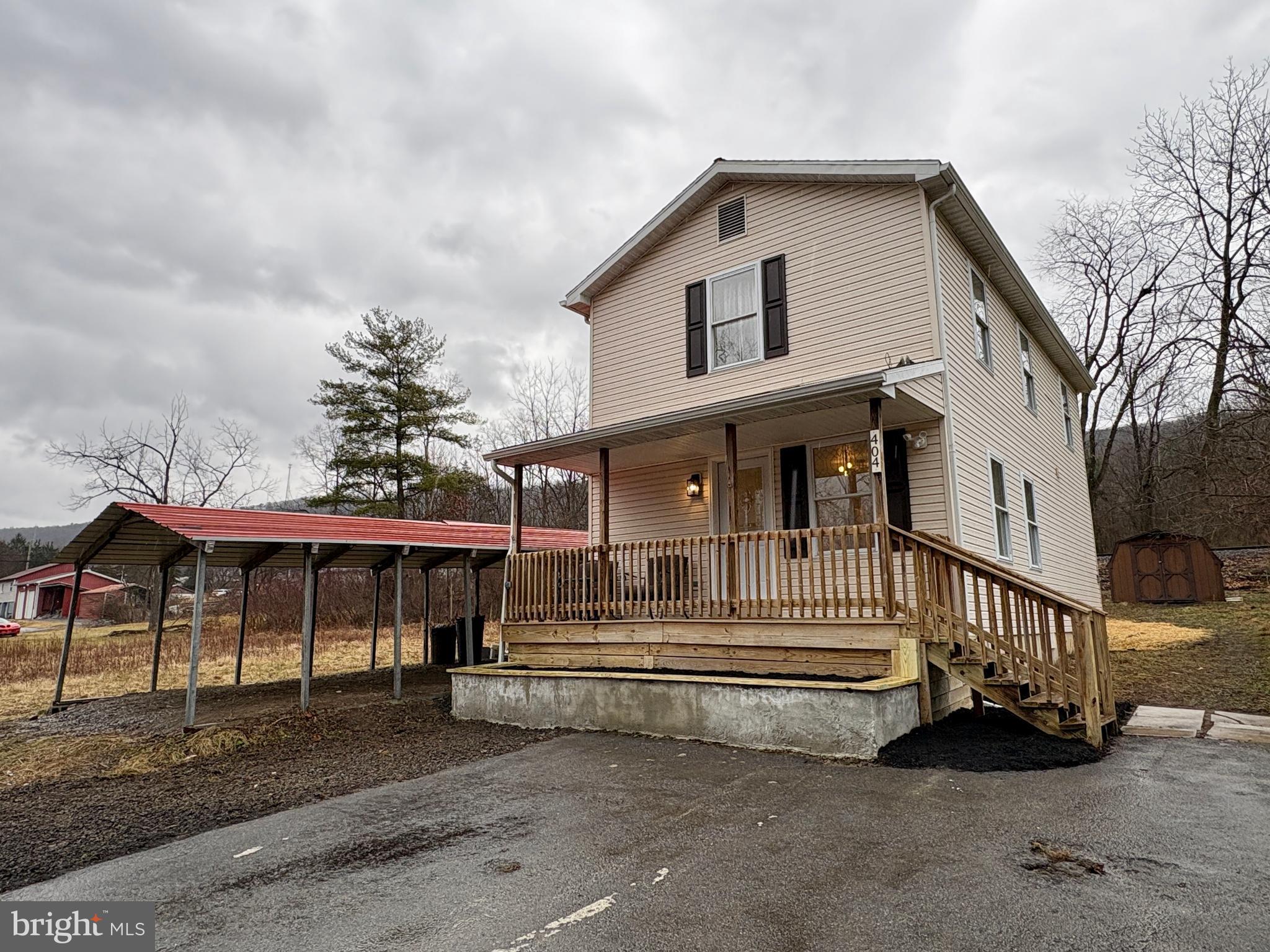a front view of a house with a porch