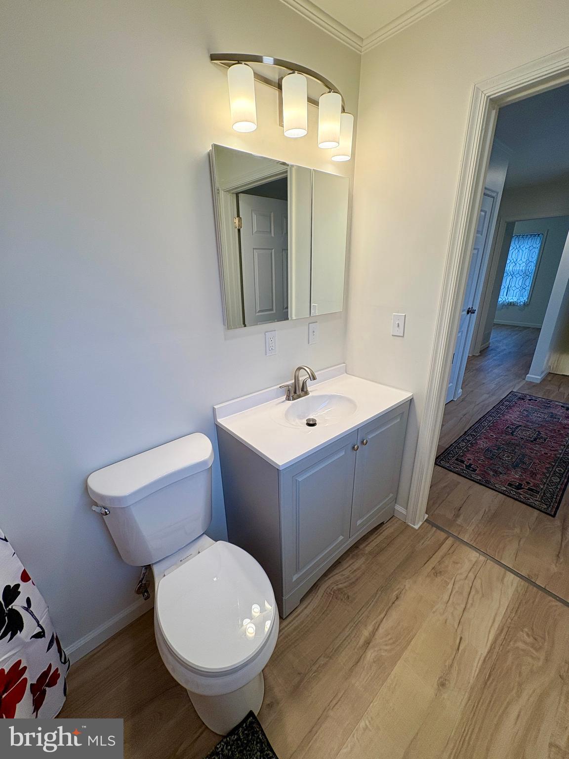 404 Front Street Port Matilda, PA 16870 - Photo 13 of 19 a bathroom with a toilet sink and mirror