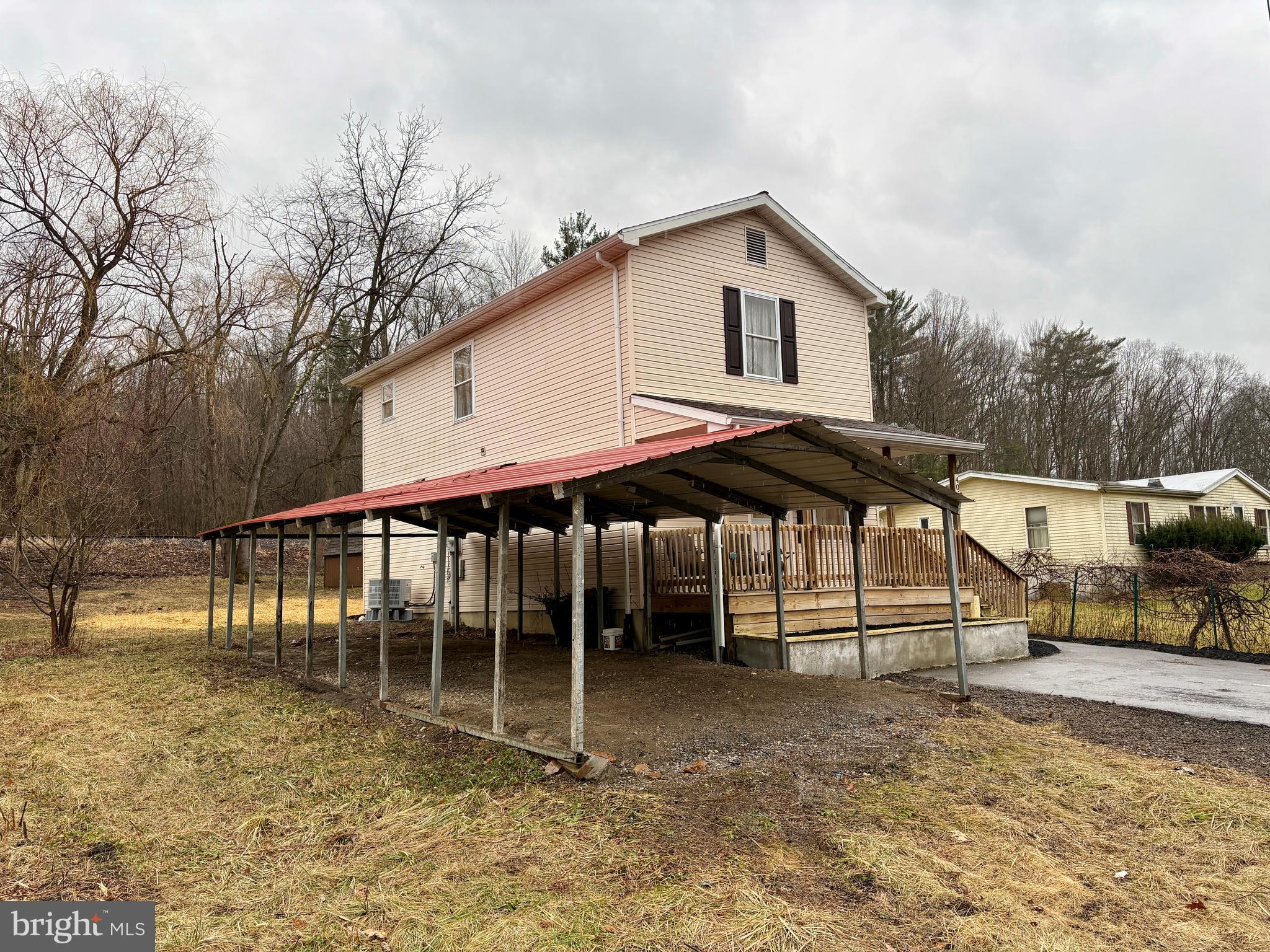 404 Front Street Port Matilda, PA 16870 - Photo 3 of 19 a backyard of a house with barbeque oven and outdoor seating