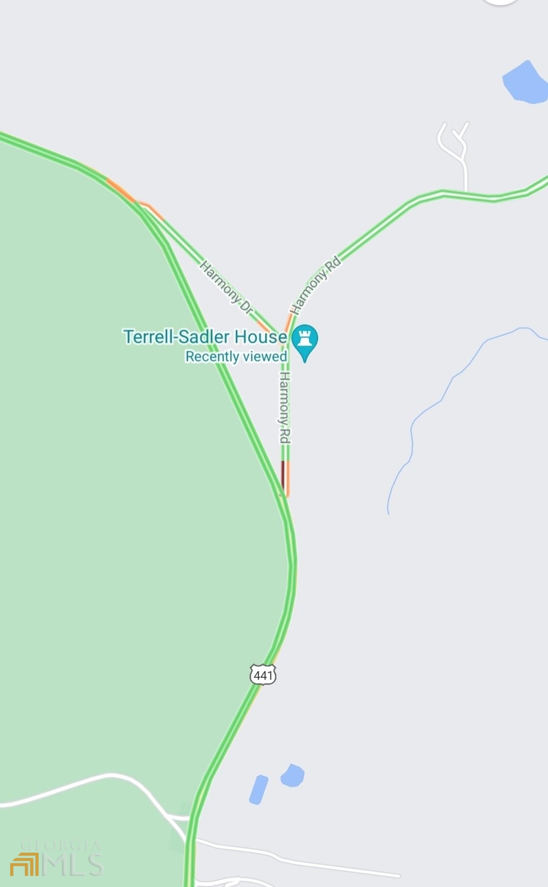 0 441 And Harmony Road Eatonton, GA 31024 - Photo 7 of 8 a view of a swimming pool with a book shelf