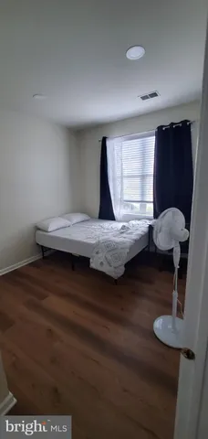 a bedroom with furniture and window