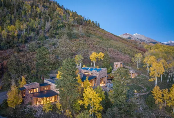 a view of house with swimming pool and porch