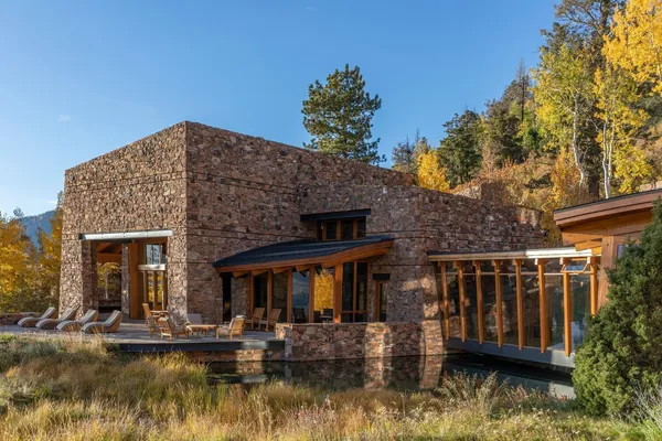 a dining room with a large window and table