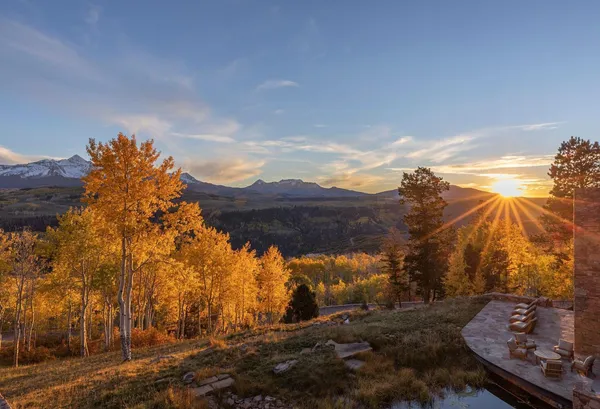 a view of a building with mountains in the background