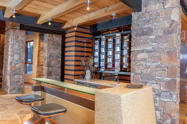 a bedroom with a bed and lamp