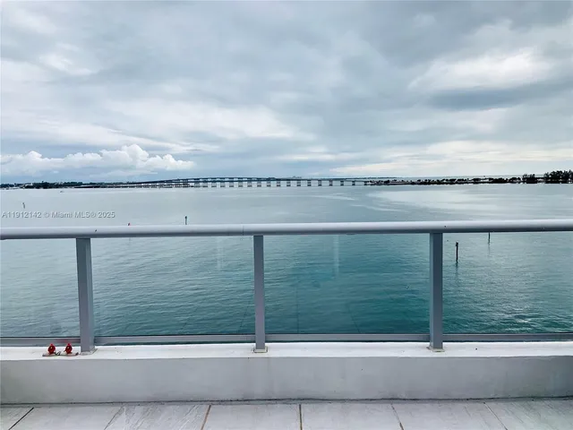 a view of a palm trees in front of a building