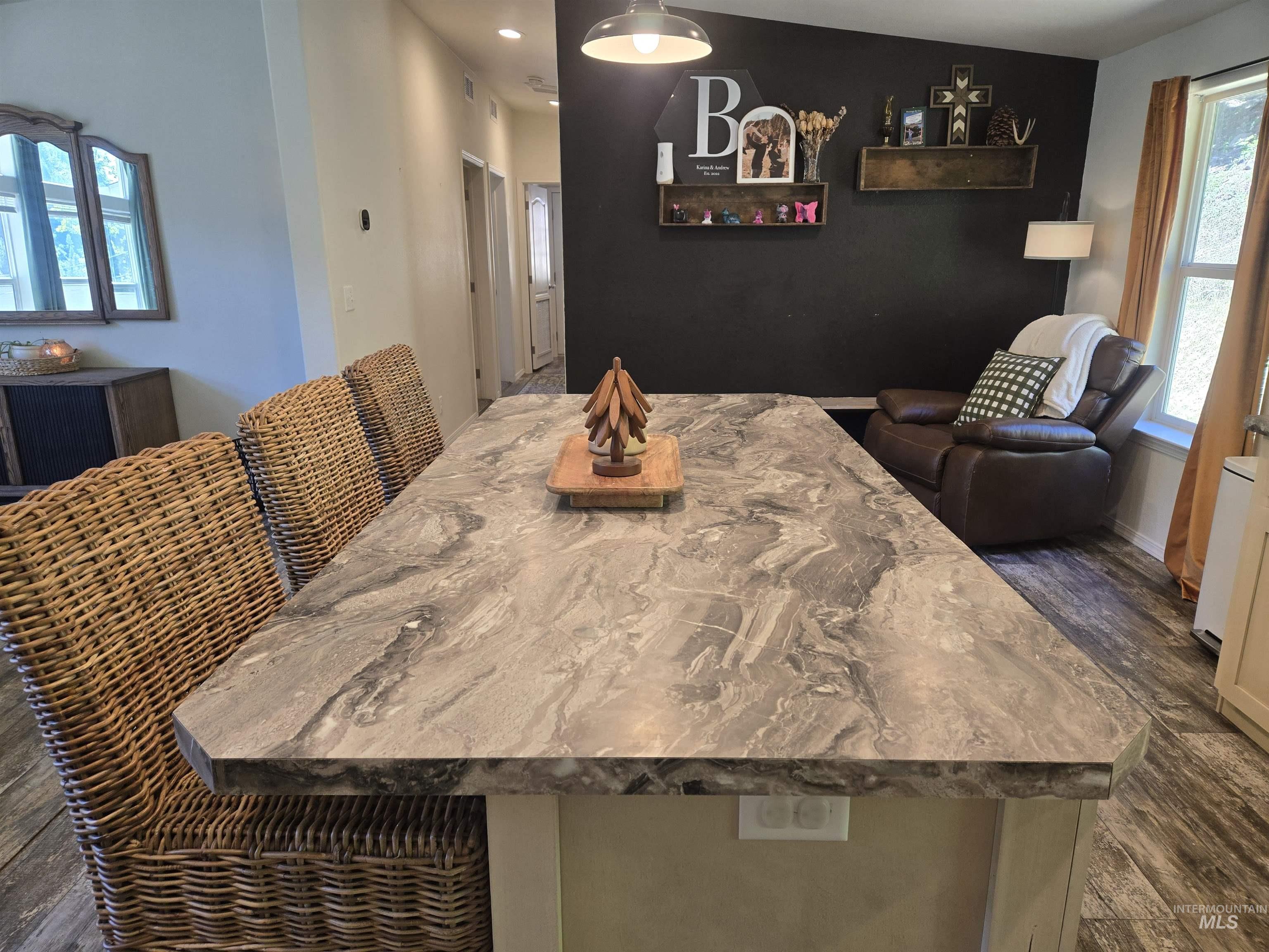 174 Konkolville Road Orofino, ID 83544 - Photo 12 of 43 Kitchen island with a patterned countertop, complementing the wood-finish flooring
