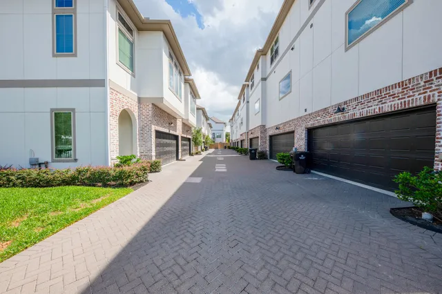 a view of a street with a building in the background