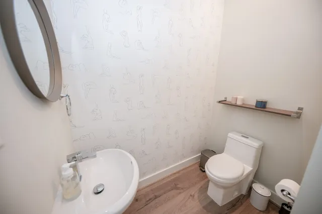 a bathroom with a toilet and a sink