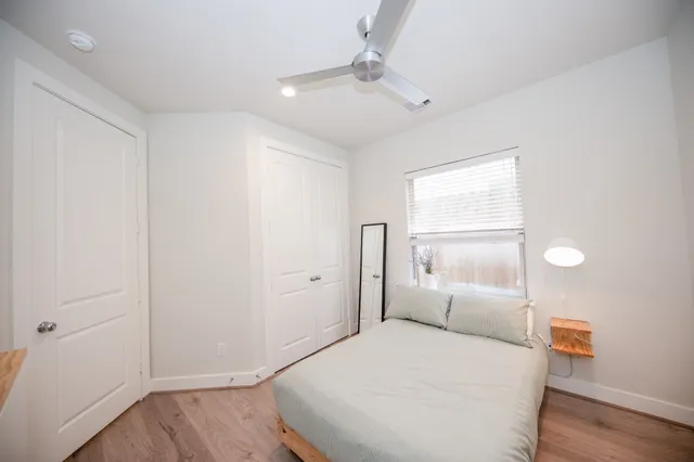 a room with a bed and a chandelier