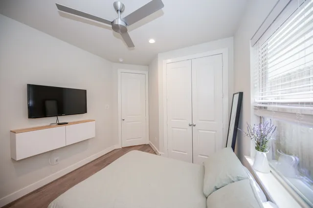 a hotel room with a bed and a flat screen tv