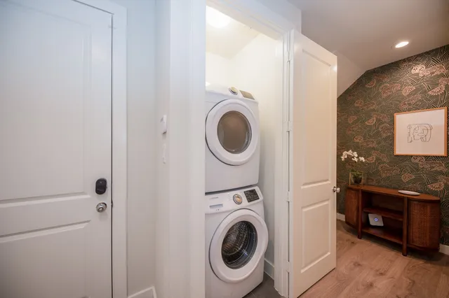 a view of a hallway with washer and dryer