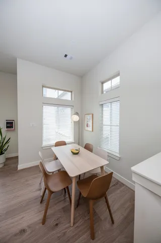 a view of a dining room with furniture and window