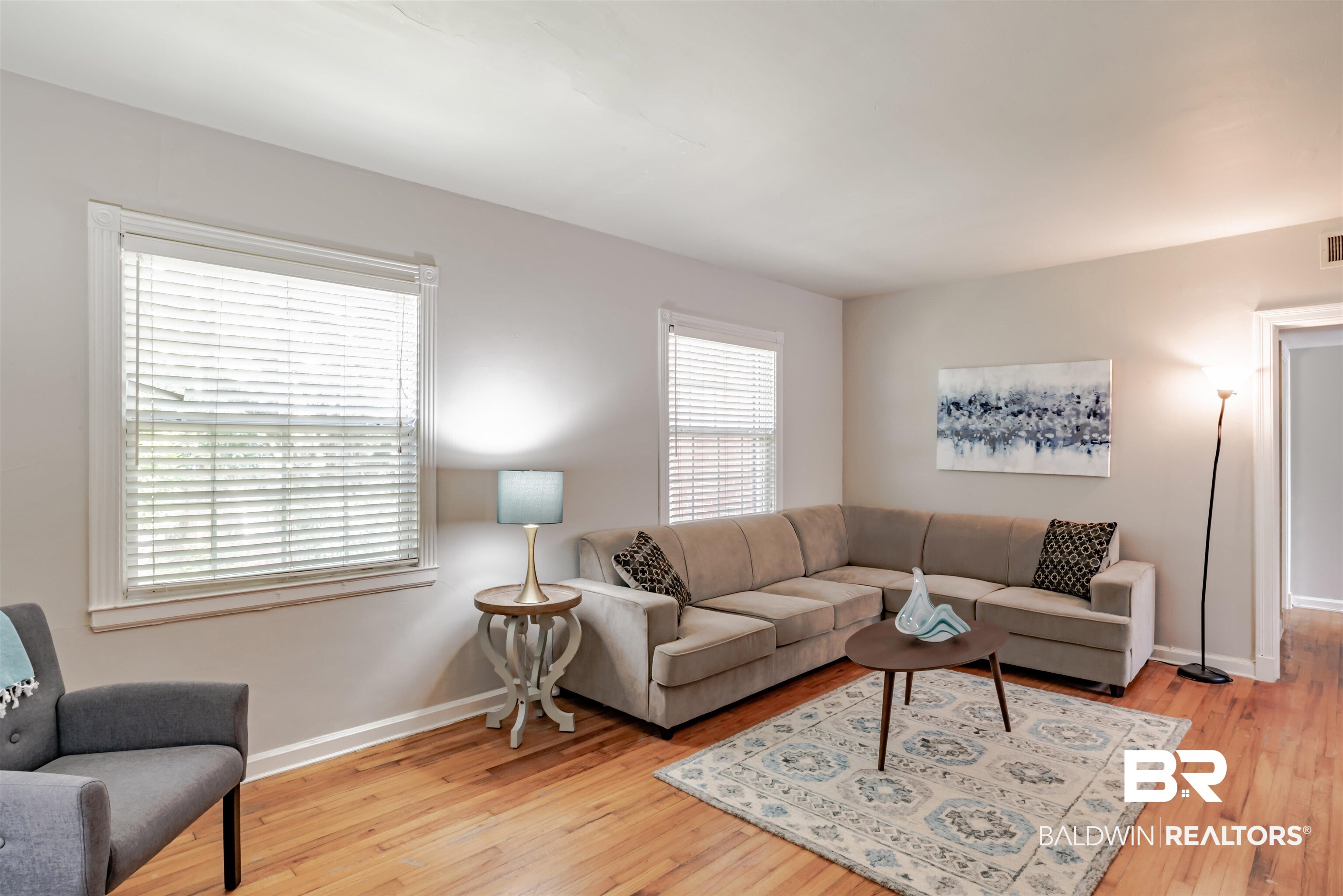214 Upham Street, Unit 7C Mobile, AL 36607 - Photo 4 of 32 Living room featuring light wood finished floors and baseboards