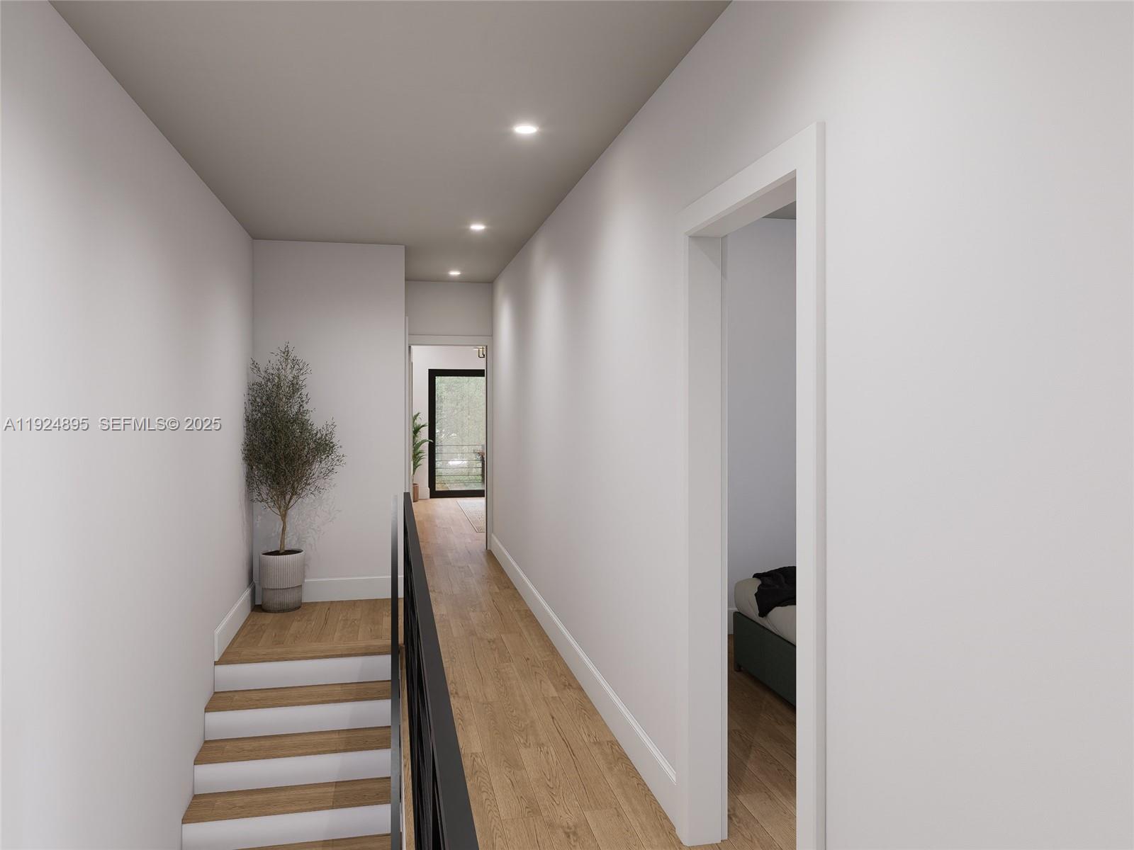 1818 Northwest 49th Street Miami, FL 33142 - Photo 13 of 16 a view of a hallway with wooden floor and stairs
