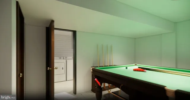 a room with pool table and windows