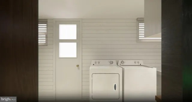a utility room with dryer and washer