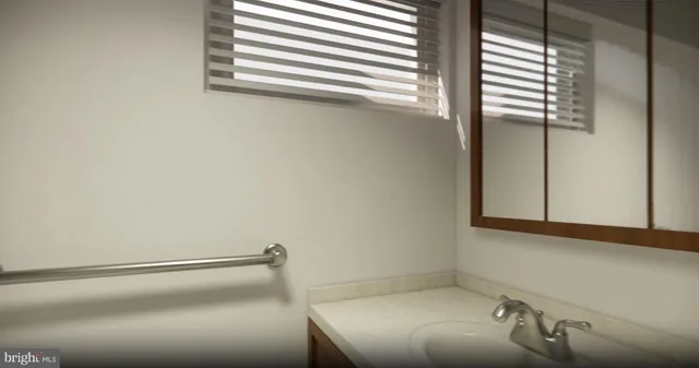 a bathroom with a bathtub and a window