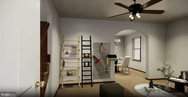 a view of a livingroom with furniture and a ceiling fan