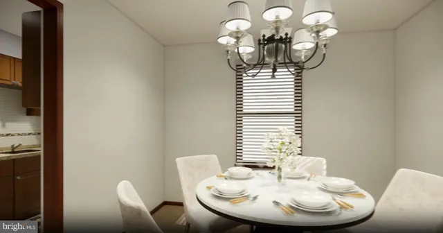 a dining room with furniture and a chandelier