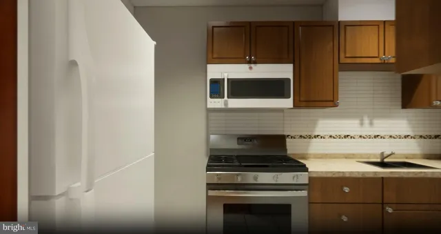 a kitchen with a stove and a microwave
