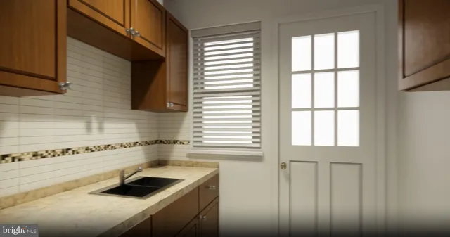 a kitchen with a window a sink and a refrigerator