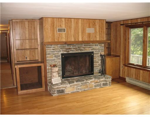 400 Mill Road Edgecomb, ME 04556 - Photo 9 of 25 Living Room. Fieldstone fireplace in...
