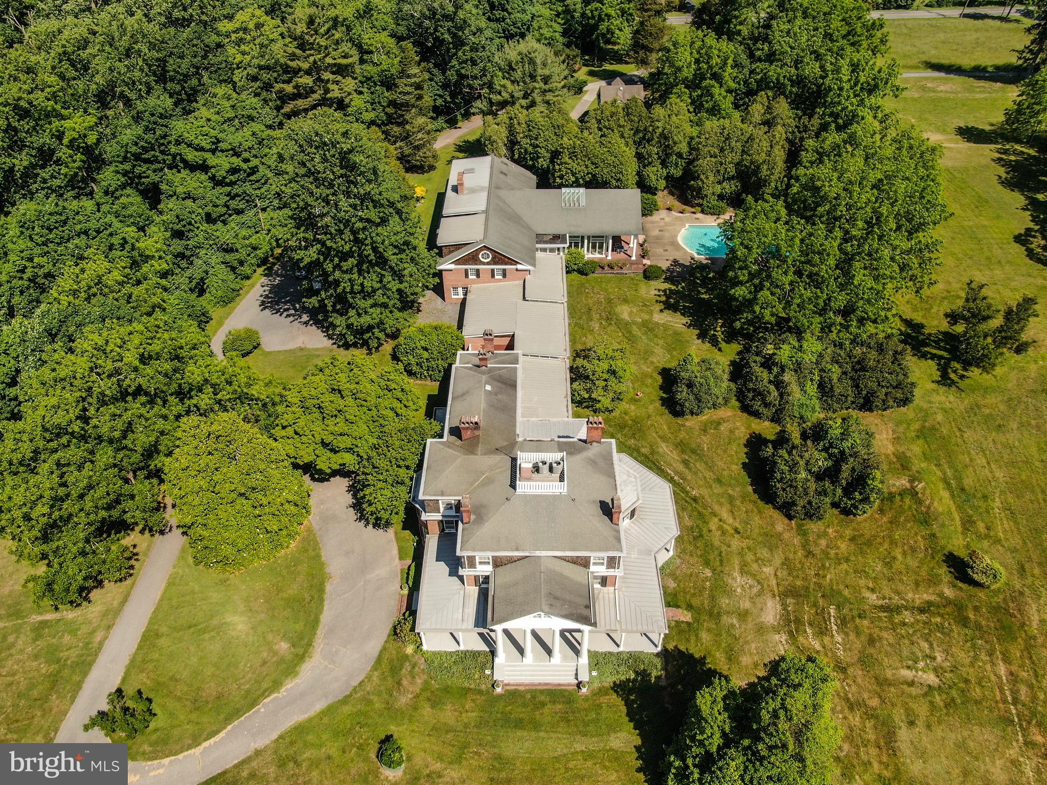 16449 Ed Warfield Road Woodbine, MD 21797 - Photo 101 of 102 an aerial view of a house with a swimming pool