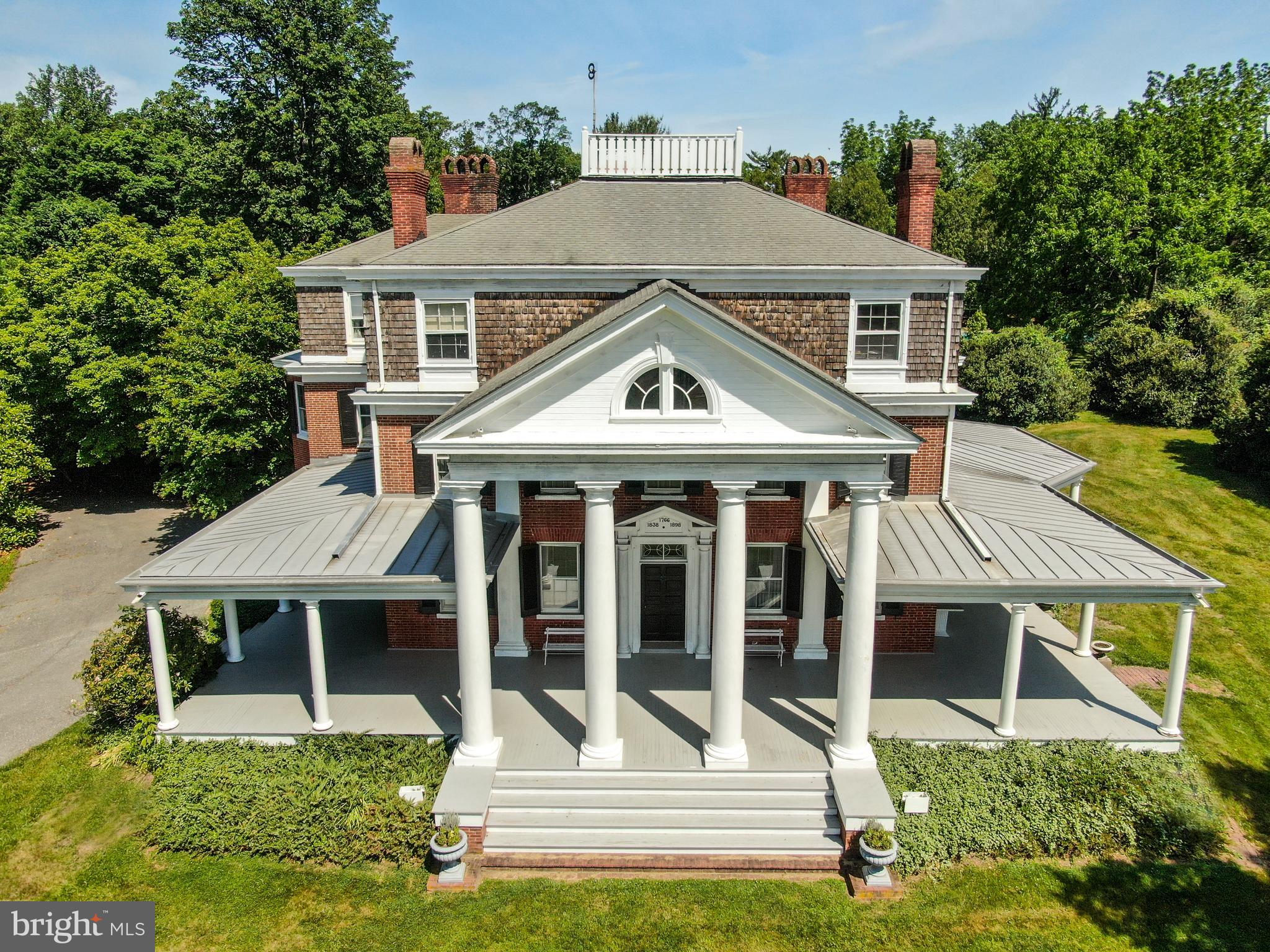 16449 Ed Warfield Road Woodbine, MD 21797 - Photo 3 of 102 a front view of a house with a yard table and chairs