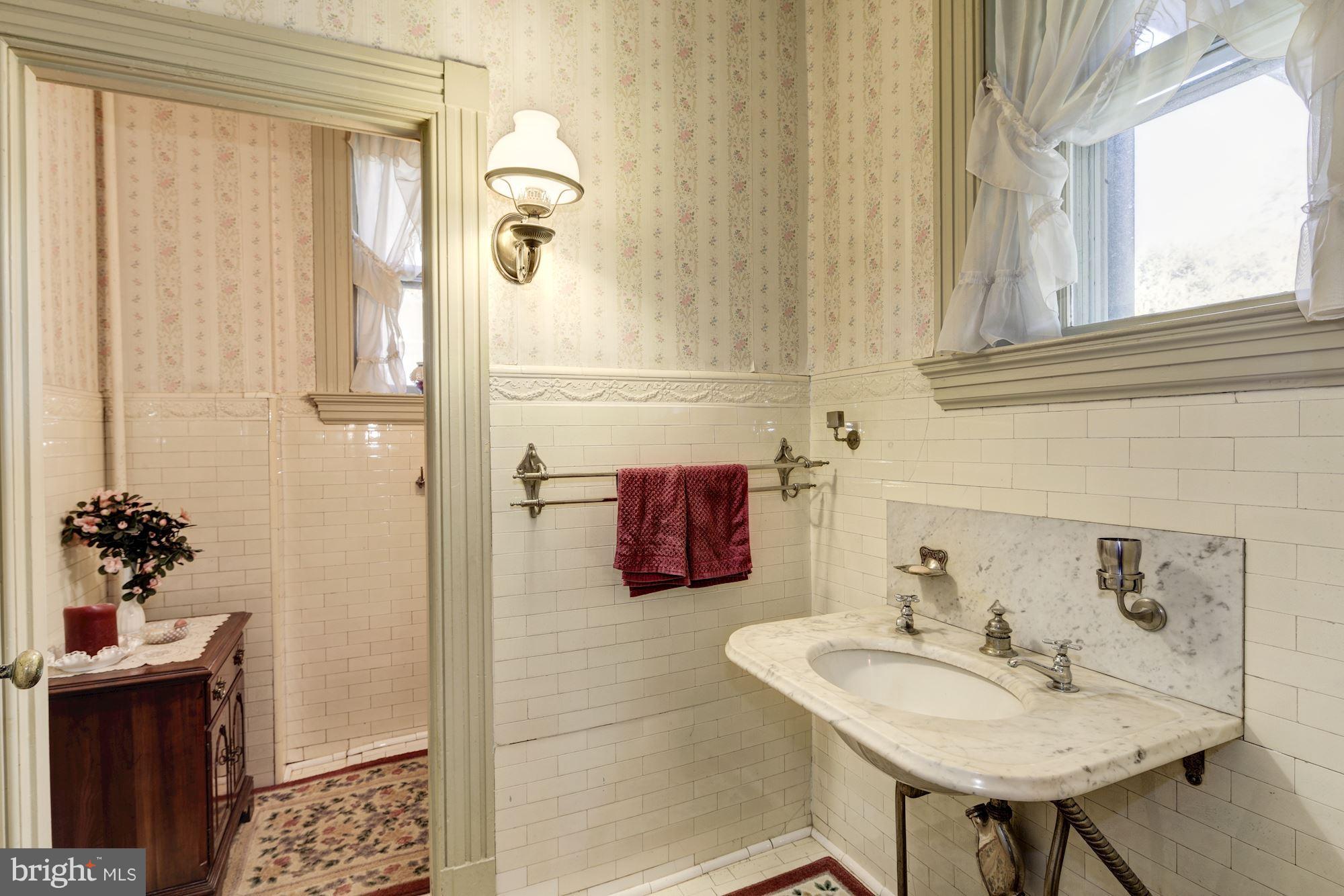 16449 Ed Warfield Road Woodbine, MD 21797 - Photo 31 of 102 a bathroom with a sink and a mirror