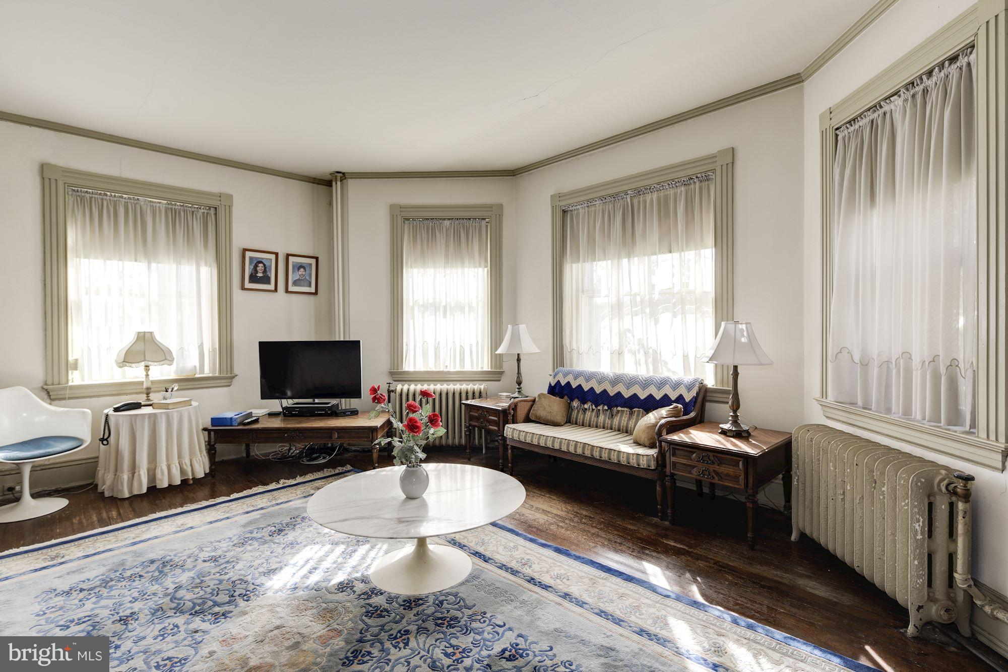 16449 Ed Warfield Road Woodbine, MD 21797 - Photo 33 of 102 a living room with furniture and a flat screen tv